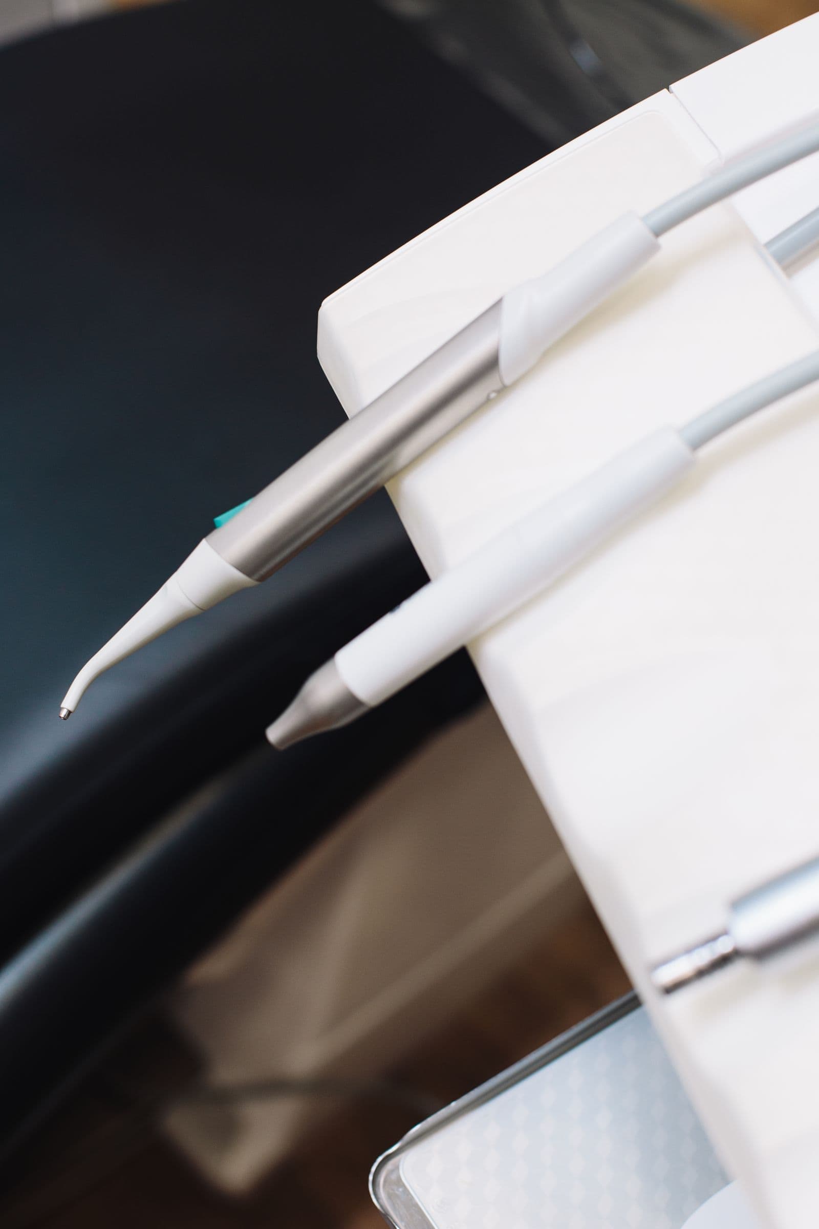 A dental handpiece in soft light