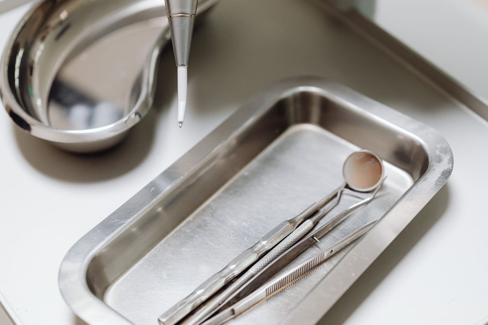 A sterile dental instrument tray, the kind of environment this work happens in